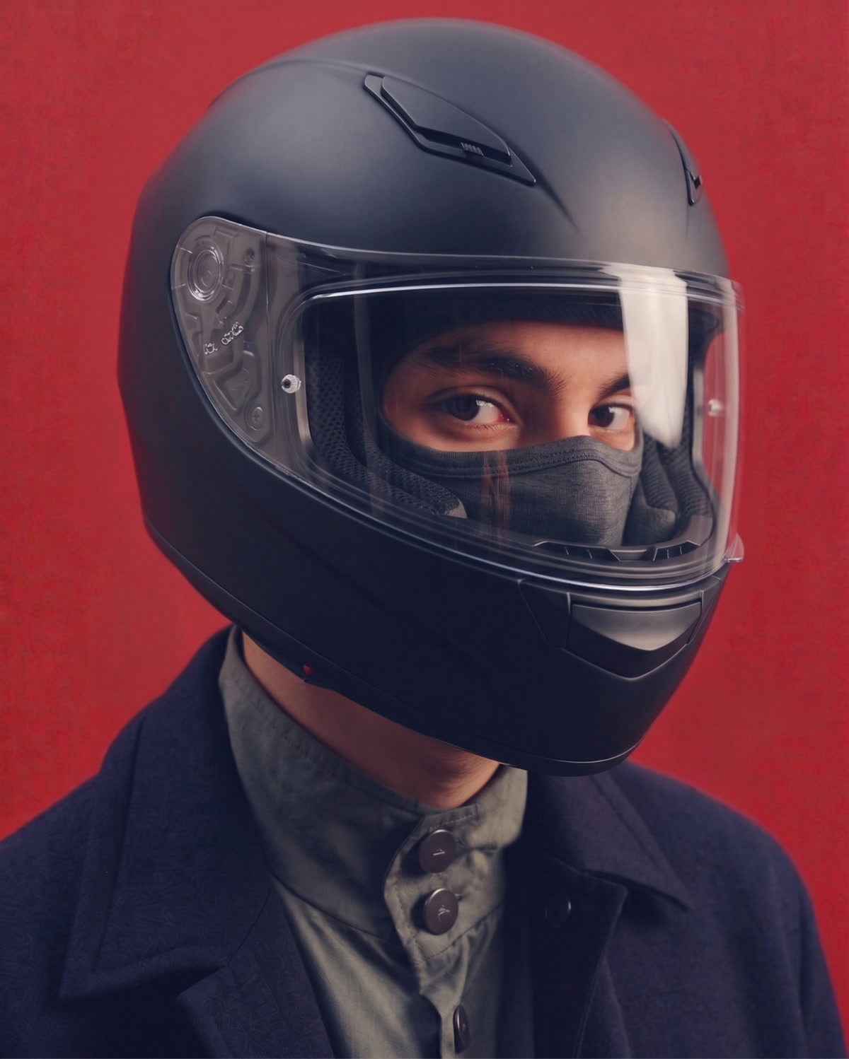 Rider wearing a black full-face helmet showing how the HAMI liner fits underneath